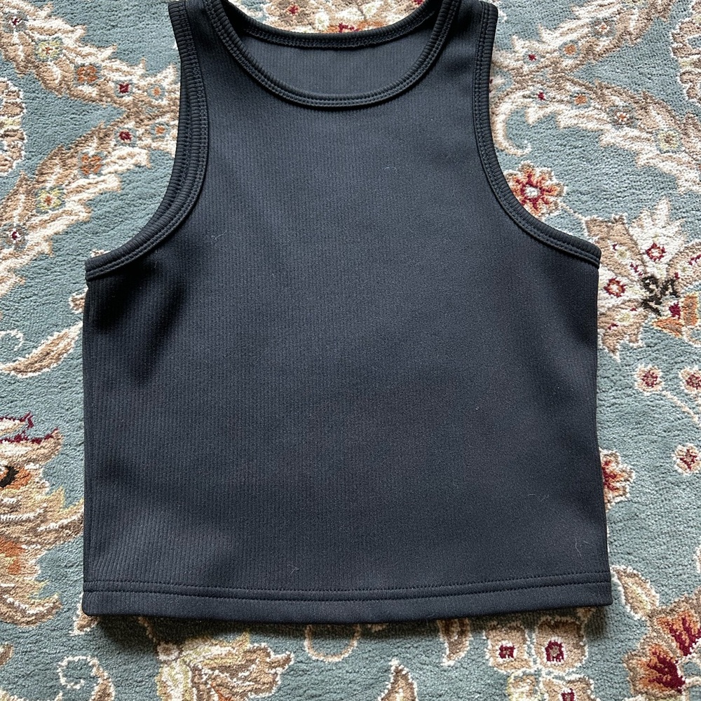Chic Black Tank Top with Ribbed Texture and Sleeveless Design